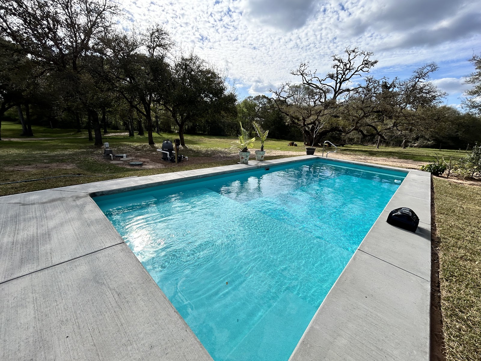 Modern Geometric Pool with Travertine Deck